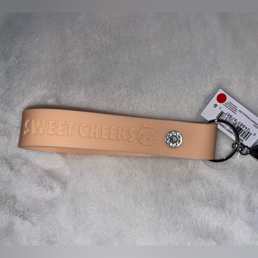 Snap wristlet. FREE with purchase.